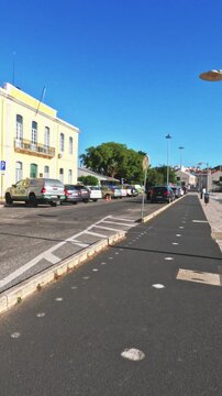 Running POV FPV, first person point of view, along the waterfront in Lisbon, Portugal. Lisboa runner raw action cam footage passing by Belem Tower, MAAT and Discoveries Monument. Sunny, bright, summer