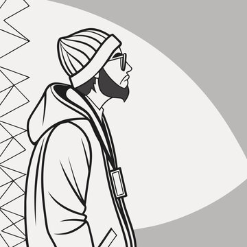 Profile view of stylish bearded man wearing beanie hat hoodie sunglasses