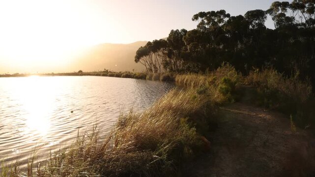 placid pond and trees overlooking Klein Mountains, Stanford, South Africa