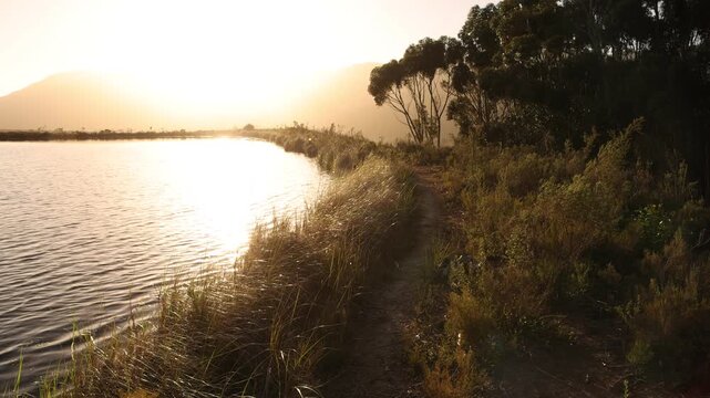 placid pond and trees overlooking Klein Mountains, Stanford, South Africa