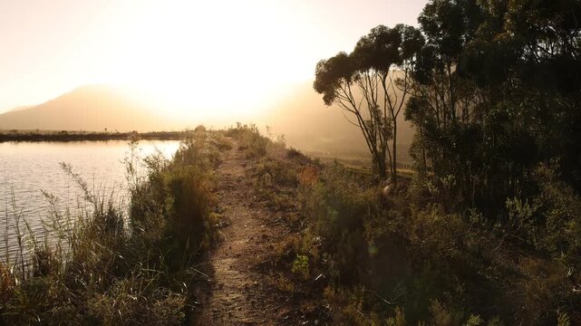 placid pond and trees overlooking Klein Mountains, Stanford, South Africa