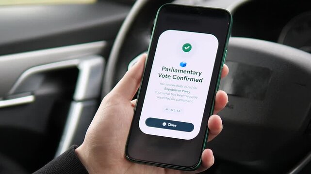 Close-up of a smartphone screen during an official parliamentary election. User selects a political party and receives a vote confirmation. Ideal for election technology, online government services