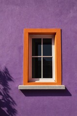 Obraz premium Portrait of orange window on purple wall background 