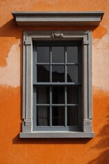 Fototapeta premium Portrait of gray window on orange wall background 