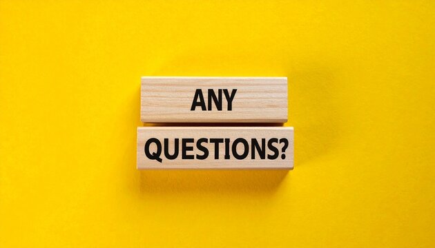 Wooden Blocks with Printed Text ANY QUESTIONS on Bright Yellow Background Symbolizing Inquiry, Curiosity, and Open Discussion Invitation
