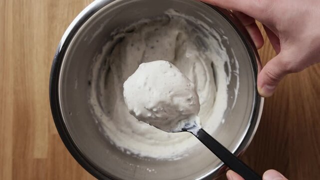 Close Up Of Ricotta And Chocolate Mixture On Spoon Top View Vert