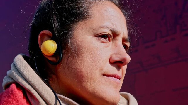 Woman smiling while listening to an audioguide in Beijing