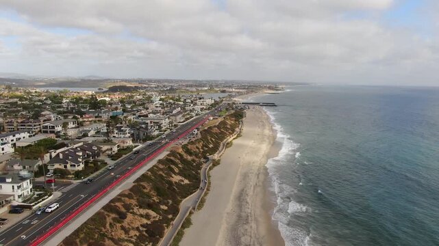 Aerial Tracking Shot of Carlsbad Boulevard Coastal Construction and Beach