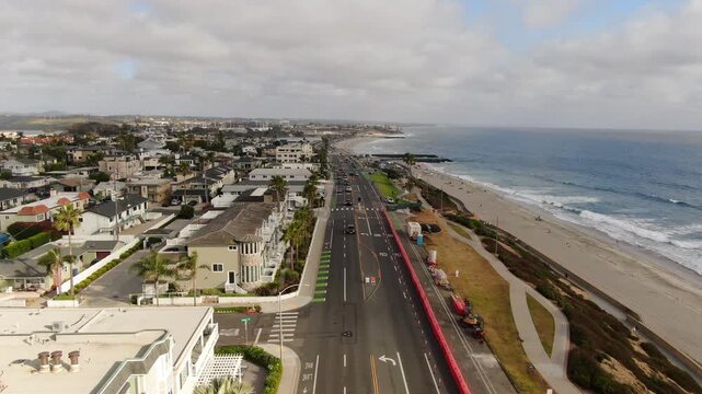 Aerial Forward Dolly Shot of Carlsbad Boulevard Coastal Roadwork and Beach