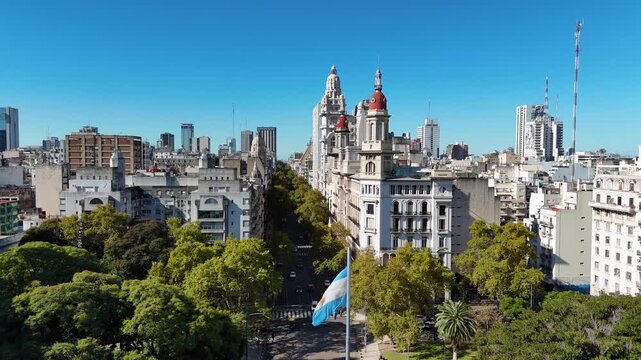 Argentinian flag waving over Avenida de Mayo in Buenos Aires