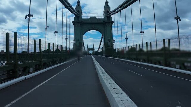 Beautiful Hammersmith Bridge in London under a cloudy sky