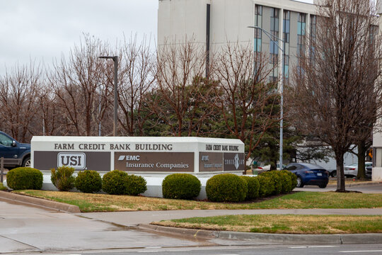 Wichita, Kansas, USA - March 22, 2022: A directory signage showing companies name such as USI Insurance Services and EMC Insurance Companies at Farm Credit Bank Building on Waco Ave in downtown Wichit