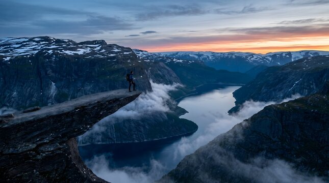 The Edge of the World: Spectacular Blue Hour Vista of Trolltunga Rock Ledge Extending Over Deep Fjords and Rugged Mountain Valleys in Norway
