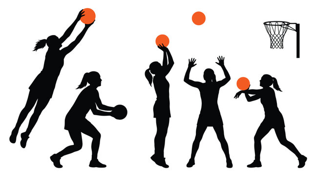 Silhouette group of women playing netball with orange balls in this dynamic action sports photograph
