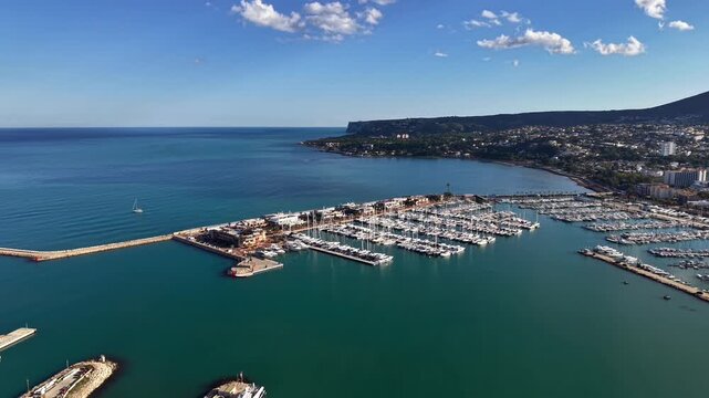 Aerial yacht marina with rows of boats and turquoise harbor vibrant port atmosphere ideal for luxury travel,