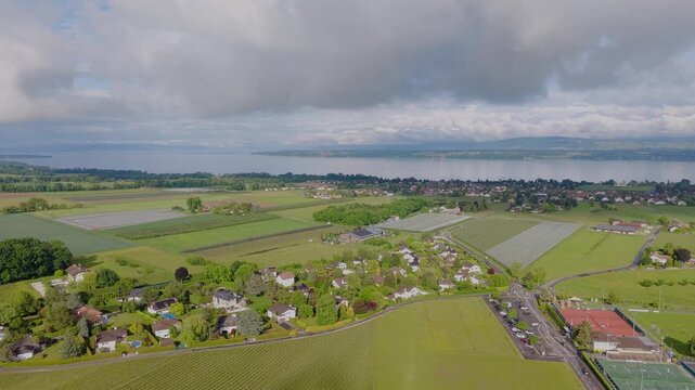 Serene Drone Flight Over Lake Geneva Charming Swiss Villages and Green Valleys in French Switzerland, Breathtaking Aerial Views of Lake Leman Picturesque Towns and Snow Capped Alps Switzerland
