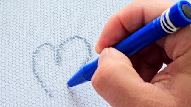 Hand drawing heart and word Love on magnetic board