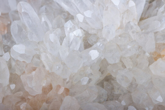 Macro view of translucent quartz crystal cluster formations geometric facets growing closely together