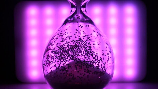 Hourglass as a symbol of passing time sand is falling time is going lifestyle art video