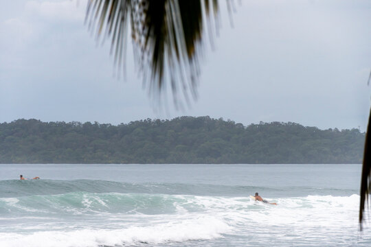 Surfers Waiting for Waves at Paunch Beach in Bocas del Toro Panama