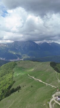 Baiu Mountains ridge trail with Bucegi panorama aerial spring Romania