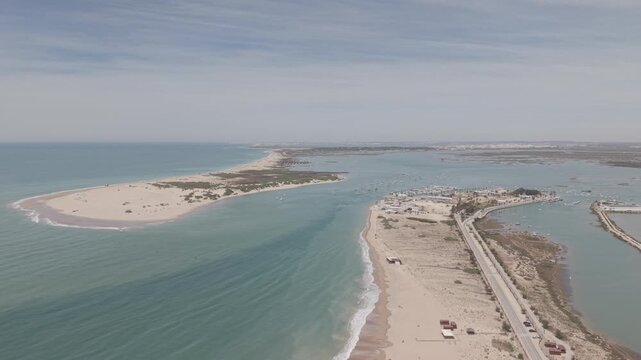 4K D-Log aerial view of the Sancti Petri Castle on its island. Professional drone footage featuring the historic fortress and turquoise Atlantic Ocean in Cadiz, Spain, ready for color grading.
