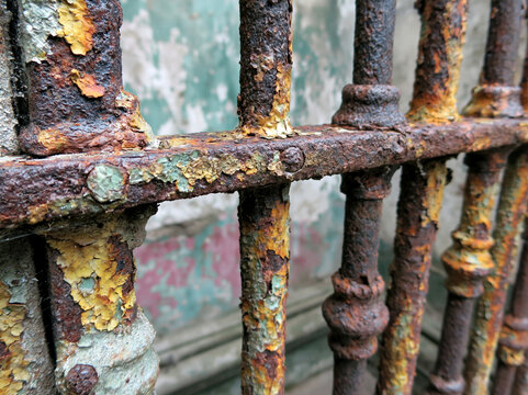 Rusty Weathered Metal Fence with Grunge Texture and Gothic Design - Industrial Urban Architecture Background