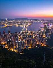 Naklejka premium Kowloon Hong Kong cityscape at dusk.