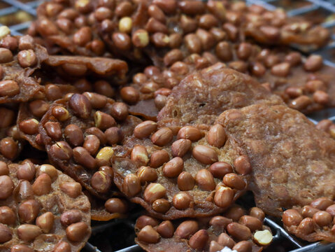 Thai Fried Peanut Crackers or Khanom Thua Thot on a Cooling Rack