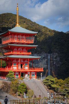 Vermilion three-storied pagoda of Seiganto-ji Temple and Nachi Falls, sacred site of Kumano Nachi, Wakayama, Japan