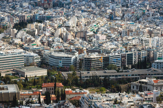 Athens, Attica, Greece, beautiful panoramic view of Athens cityscape, with The Parthenon, mountains, sea and scenery beyond the city, seen from Mount Lycabettus Hill observation deck in a sunny day