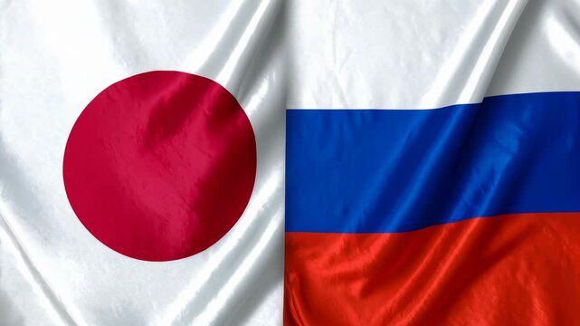 日本国旗とロシア国旗の布地が並び国際関係と外交の複雑さを示す象徴的な場面