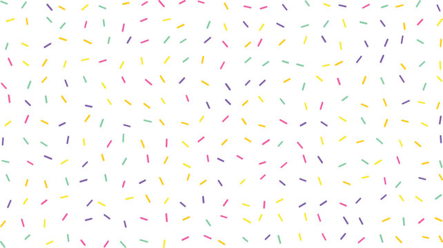Colorful candy sprinkles scattered playfully across a clean white surface creating a vibrant sweet pattern