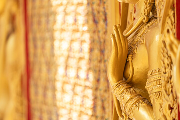 Fototapeta premium High relief guardian figure temple door Prasat Thong Kham Kanchanaphisek golden palace Wat Chantharam, ThaSung UthaiThani Thailand gilded ornament mirrored mosaic.