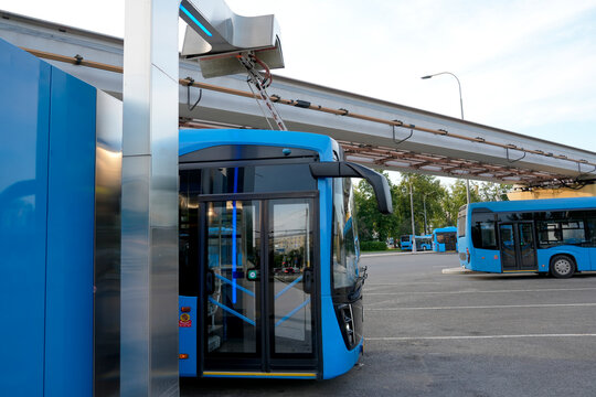 Electric buses are in the parking lot on a charge. Eco-friendly urban public transport