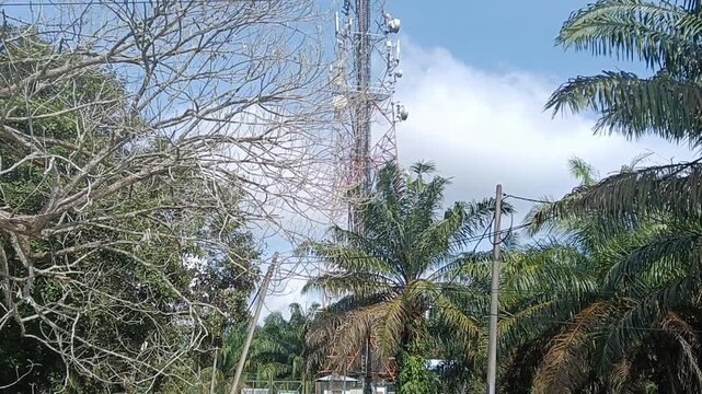 telecommunication tower and blue sky and cloudin rural area .    close up in malaysia.4G and 5G tower