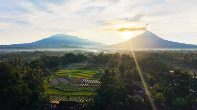 Aerial Drone View of Mount Merapi and Mount Merbabu at Sunrise in Central Java Indonesia