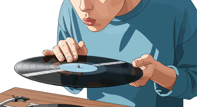 A person in a blue shirt holds a vinyl record, blowing dust off it near a turntable