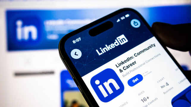 Closeup of a smartphone screen displaying the linkedin app store page, showcasing professional networking and career development opportunities