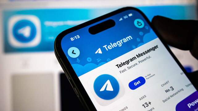 Closeup of a smartphone screen displaying the telegram messenger app download page on the apple app store