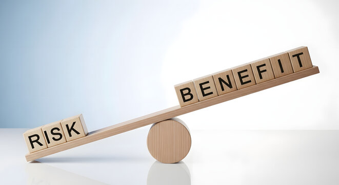 A seesaw with risk and benefit blocks balancing on a cylinder on a table