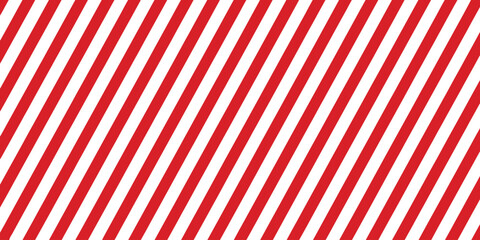Fototapeta premium Striped candy cane seamless pattern for Christmas or New Year decoration, red and white diagonal stripes background, Xmas gift wrap, winter holiday present wrapping paper. vector illustration