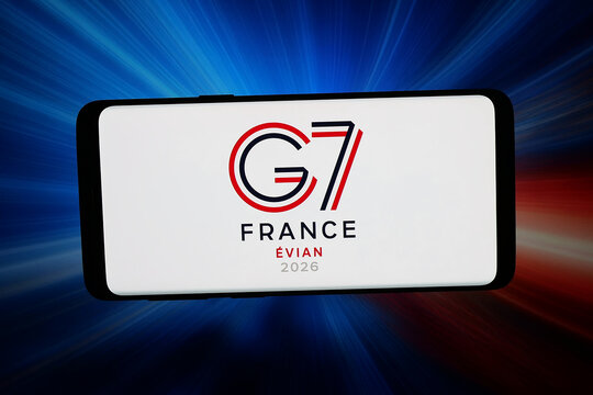 Stuttgart, Germany - 05-13-2026: In this photo illustration, the logo of the 52nd G7 Summit (Evian-les-Bains, France) is displayed on a smartphone in front of abstract background on computer screen.
