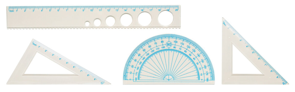 Set of white plastic geometry measurement tools, ruler, protractor, and set squares isolated on white background