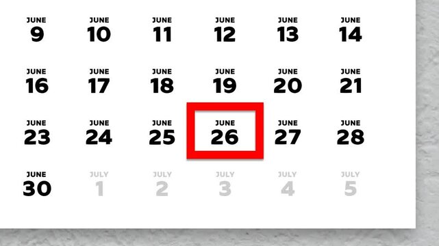 The date June 26th marked with a red cursor on the wall calendar 2026