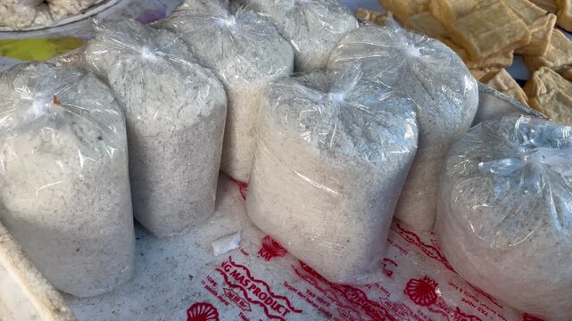Traditional iodized table salt packaged in clear plastic bags