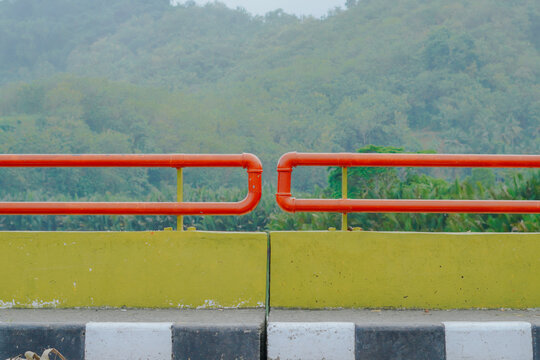 A landscape format photograph capturing the symmetrical details of the bridge guardrail structure.