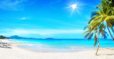 Fototapeta premium Sea beach landscape, paradise tropical island, green coconut palm tree leaves, white sand, turquoise ocean water, blue sunny sky, beautiful exotic nature, hot day on summer holidays, vacation, travel