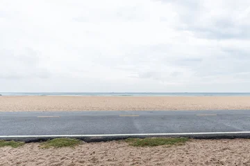 Fototapeten Weiß Side view of asphalt road with beach on sea and beautiful sky.  © yotrakbutda
