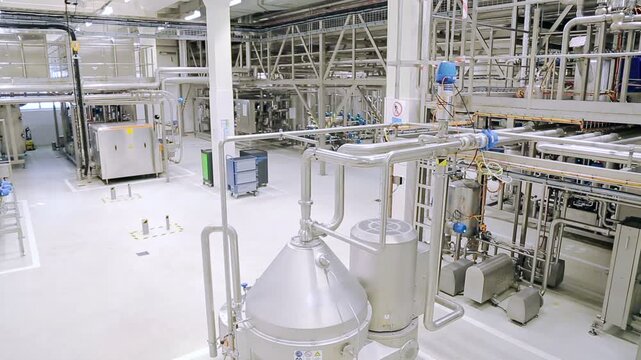 Modern Food Processing Facility with Stainless Steel Pipes and Tanks